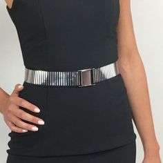 "Silver Stylish Girls Ladies Women Skinny Waist Belt, Silver waist belt, Silver elastic belt, Minimalist silver belt, Metallic waist belt, Evening belt, Silver belt. An easy to wear elastic silver belt , that  is very chic and discrete,  when one wants to add a touch of silver in their looks. Match with silver accessories like a silver clutch or silver shoes. It looks great with lots of outfits, like total white or total black looks.   One size fits all ( suitable for sizes S,M,L) Also available Adjustable Metal Party Belt, Trendy Silver Belt Buckle With Belt Included, Modern Silver Belt For Formal Occasion, Silver Adjustable Belt For Formal Wear, Silver Adjustable Belt For Formal Occasions, Trendy Silver Belts For Party, Trendy Silver Belt For Party, Chic Silver Chain Belt For Party, Trendy Silver Party Belt