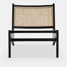 a black and white chair with woven seat