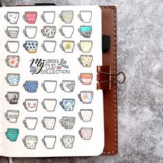 an open notebook with coffee cups drawn on it