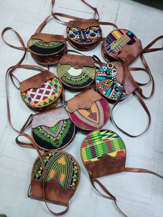 This is a set of complete 10 tote leather bags. They are totally made of fabric and leather and comes in different colours, size and designs.Place your orders for this amazing deal as for both retail and wholesale Oromo Jewelry, Kitenge Bags, Fancy Handbags, Afrocentric Jewelry, Ankara Bags, African Bag, African Crafts, African Accessories, Diy Leather Bag