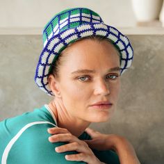 Hand-crocheted by female artisans in Java, Indonesia, this Wimbledon plaid crochet hat is a reminder of the beautiful feeling of being outdoor. Its fresh green grass and bright blue sky color invite us to celebrate the seasons in the sun. 100% Cotton Biodegradable, ethically made Hand wash, dry clean Green Yarn Bucket Hat With Curved Brim, Green Yarn Sun Hat One Size, Green Knitted Hat For Spring, Green Wide Brim Sun Hat, Green Knitted Summer Hat, Green Knitted Crochet Hat For Summer, Green Crochet Bohemian Bucket Hat, Green Crochet Hat Made Of Yarn, Green Brimmed Crochet Hat For Outdoor