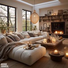 a living room filled with furniture and candles