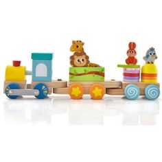 a wooden toy train with animals and other toys on the front, sitting on a white surface