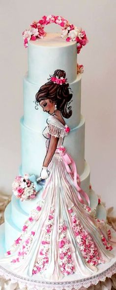 a three tiered blue wedding cake with pink flowers on the top and bottom layer