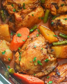 chicken, carrots and green beans in a pot