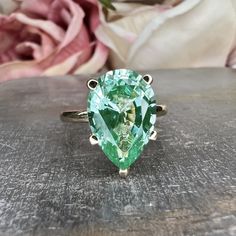 "Pear Shaped Paraiba Tourmaline Engagement Ring Yellow Gold Unique Green Pear Cut Paraiba Tourmaline Solitaire Wedding Promise Rings This ring can be made with many different stone colors Message us for pricing on different color/type stones Instagram: https://www.instagram.com/p/B0jFDfSlNRF/ -Approximate total carat weight: 4.10ctw diamond equivalent -Center Stone Size: 13x9mm - approx. 4.10ct diamond equivalent -Center Stone Shape: pear shape 13x9mm -Gem Type: lab created green paraiba -Stone Green Pear Shape Engagement Ring, Paraiba Tourmaline Engagement Ring, Tourmaline Meaning, Paraiba Tourmaline Ring, Engagement Ring Yellow Gold, Engagement Ring Yellow, Tourmaline Engagement Ring, Set Rings, Emerald Wedding Rings