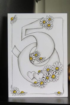 a drawing of the number five with daisies