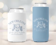 two new orleans beer cans on a table