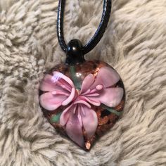 Three Pink Flowers Against A Shimmering Copper Background. On A 20”Black Cord Necklace. Horseshoe Necklace Gold, Copper Background, Key Charm Necklace, Lampwork Pendant, Black Cord Necklace, Lampwork Jewelry, Horseshoe Necklace, Amethyst Necklace Pendant, Gold Cross Necklace