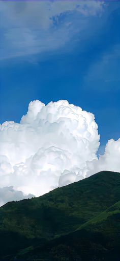 there is a large cloud in the sky above some hills and trees on a hill