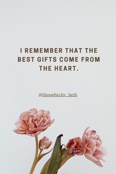 two pink flowers in a vase with a quote about the best gifts come from the heart