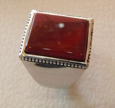 Rectangular silver aqeeq flat natural semi precious agate carnelian gemstone men ring sterling silver 925 jewelry all sizes fast shipping Risk free Quality guarantee policy : If you are not satisfied with your item for any reason simply send it to us and you will get a replacement or refund . please write or choose your size with the order and we will size it for you . Our ring is handcrafted mostly with a few simple tools . but some methods are used in casting like lost wax method . sterling si Formal Chalcedony Jewelry With Polished Finish, Classic Agate Jewelry With Polished Finish, Silver Carnelian Cabochon Jewelry, Formal Carnelian Cabochon Jewelry, Classic Chalcedony Ring Jewelry, Silver Carnelian Jewelry For Anniversary, Silver Jewelry With Rectangular Stone And Polished Finish, Silver Jewelry With Polished Rectangular Stone, Classic Silver Agate Jewelry