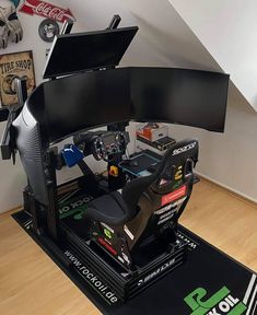 a video game console sitting on top of a mat in front of a stair case