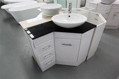 a white sink sitting on top of a counter