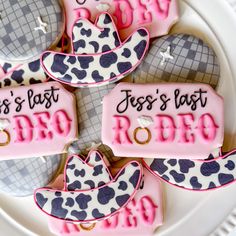 decorated cookies are arranged on a plate with the words, jesus's last rodeo