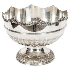 a large silver bowl on a stand