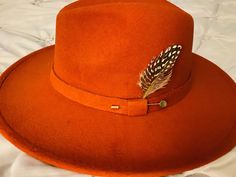 This is a beautiful classic wide brim in a rust color with accents  Classic and beautiful and certainly for the fall and winter season  Shipping time is 1-2 weeks based on the current conditions  Hat fits 58-60 cm  Unisex hat for both Men and Women All sales final! Perfect gift as well! You will sure to turn heads with this hat! Wide Brim Hat Men, Pink Beret, Brown Fedora, Beaded Hat, Distressed Hat, Hat Fits, Wool Fedora, Classic Hats, Quality Hats