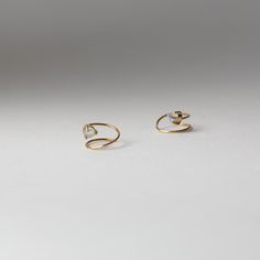 3mm round rose-cut moonstone on a 14-karat solid gold curl earring. Curls hug the ear and stay secure by pulling all the way through. Sold as a pair. Item will vary due to nature of the stone. 14k Yellow Gold Ear Cuff For Wedding, 14k Yellow Gold Ear Cuff As Gift, Dainty Yellow Gold Ear Cuff For Wedding, Minimalist Yellow Gold Cartilage Earrings For Wedding, 14k White Gold Ear Cuff As A Gift, 14k White Gold Ear Cuff Gift, 14k Gold Round Ear Cuff As Gift, 14k Gold Wedding Ear Cuff For Pierced Ears, Round 14k Gold Ear Cuff As Gift