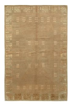 an antique rug with squares and dots on it, in beige tones or brownstone colors