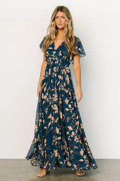 This gorgeous navy maxi gown is perfect for all seasons! The beautiful flow of the material and deep V neckline will have you feeling whimsical. Green Bohemian Chiffon Dress With Floral Print, Green Bohemian Floral Print Chiffon Dress, V-neck Chiffon Maxi Dress With Print, Printed Chiffon V-neck Maxi Dress, Flowy Chiffon Dress With Floral Print And Short Sleeves, V-neck Chiffon Printed Dresses, Chiffon Maxi Dress With Floral Print And Surplice Neckline, Green Maxi Dress With Floral Print And Flutter Sleeves, Flowy Green Chiffon Dress With Floral Print