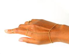 A streamlined, layering simple gold bracelet.  ---- SIZING  Your wrist size can be selected from the drop down for a custom fit. A 1.5 inch extension is added to the length chosen to ensure proper fit.  ----  PACKAGING  Packaged in our signature jewellery box ready for gift giving and Bracelet Ring Chain, Rose Hold, Gold Hand Chain, Gold Bracelet Simple, Goddess Jewelry, Simple Ring, Gold Hand, Bracelet Women, Gold Diamond Earrings