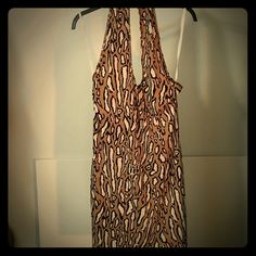 Stretchy Polyester/Spandex Animal Print Dress. Metal Detail At Neck. Lined. Stretch Printed Dress For Night Out, Printed Fitted Halter Neck Mini Dress, Chic Stretch Printed Dress, Stretch Brown Halter Neck Dress, Brown Stretch Halter Neck Dress, Animal Print Dress, Metal Detail, Animal Print Dresses, Polyester Spandex