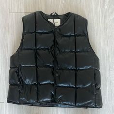 Chic And Warm Black Puffer Vest From Aritzia. Buttons Down The Front With Two Pockets. Never Worn - New With Tags. Black Puffer Vest For Spring, Black Puffer Vest For Winter, Black Cold Weather Vest Outerwear, Black Vest Outerwear For Cold Weather, Trendy Black Puffer Vest, Trendy Black Vest Outerwear, Trendy Black Outerwear Vest, Black Fitted Vest For Cold Weather, Fitted Black Vest For Cold Weather