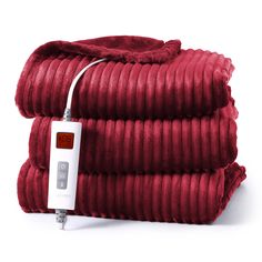 the cord is plugged in to an electric blanket that's folded on top of each other