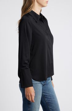 A covered placket and flared sleeve cuffs add a tailored touch to a staple shirt. 25 1/2" length Hidden-button placket Spread collar Long sleeves with flared, one-button cuffs 51% rayon, 45% polyester, 4% spandex Hand wash, dry flat Imported Semi-formal Sleek Collared Blouse, Semi-formal Collared Blouse With Placket, Semi-formal Collared Shirt With Cuffed Sleeves, Semi-formal Button-up Blouse For Fall, Elegant Shirt With Shirttail Hem And Placket, Elegant Shirt With Placket And Shirttail Hem, Semi-formal Button-up Tops For Fall, Semi-formal Fall Button-up Blouse, Chic Long Sleeve Blouse With Roll-up Sleeves