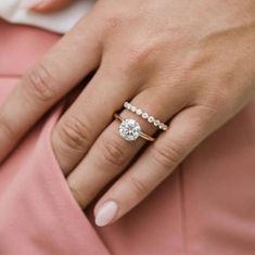 a woman's hand with a ring on her finger