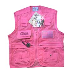 a pink vest with an american flag and patches on the chest, along with other items