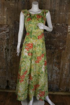 "Beautiful romantic meadow print maxi dress, made in 1970s by Carl Olsen. Made from a polyester fabric in shades of green, red and yellow, it`s sleeveless with a ruffled neckline. Fitted at the waist, it has a floaty A-line skirt, falling to maxi length. Perfect for a summer event. Labelled size 16, would fit a current UK 12. Measures 38\" bust, 29\" waist, 42\" hips. Length 55.5\" from shoulder to hem. In superb original condition, possibly unworn." Vintage Sleeveless Maxi Dress For Garden Party, 1970s Style Maxi Length Lined Dress, 1970s Style Lined Maxi Dress, Vintage Floral Print Maxi Dress For Summer, 1970s Style Green Summer Dresses, Vintage Green Floral Print Dress, 1970s Fitted Green Maxi Dress, 1970s Style Fitted Green Maxi Dress, Fitted 1970s Style Green Maxi Dress