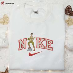 Atlantis x Nike Embroidered Shirt: The Lost Empire Cartoon Design - Unique & Stylish Apparel Nike Cartoon, Maroon Hoodie, Best Valentine's Day Gifts, Patrick Star, Hoodie Material, Custom Nikes, Embroidered Clothes, Embroidered Sweatshirt, Blue Sweatshirt