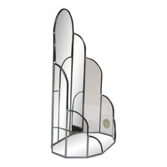 a mirror that is sitting on top of a stand in the shape of an arch