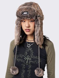 Stay warm in style with the Masha Fluffy Trapper Hat in brown faux fur. This winter essential combines comfort and fashion, offering a cozy and vintage solution to chilly days. Elevate your winter wardrobe with the warmth and timeless appeal of this faux fur trapper hat. Fluffy Hat, Fur Trapper, Fur Trapper Hat, Trapper Hat, Trapper Hats, Fur Hat, Birthday List, Futurism, Winter Essentials