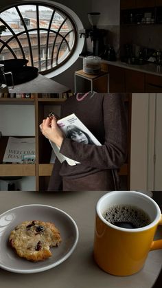 a woman holding a cup of coffee next to a plate with a cookie on it