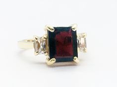 Don't miss this opportunity to own this beautiful gemstone ring crafted in 14k gold filled => Gemstone Type - Garnet, Clear Quartz => Gemstone Cut - Faceted => Gemstone Size - 8*10 mm, 3*5 mm => Total Number of Gemstones - 3 => Metal Type - 14k Gold Filled (Tarnish Resistant And Nickel Free) - also available in 925 sterling silver * Please contact me for pricing on a sizes larger than 11 * ~ Feel free to ask me about custom made designs. ❏ Replacements and custom orders : ✪ 925 st Formal Rectangular Birthstone Ring, Formal Rectangular Rings With Gemstone Accents, Rectangular Ruby Ring In Gold, Rectangular Ruby Ring For Anniversary, Anniversary Ruby Ring With Rectangular Stone, Three Stone Rectangular Jewelry Gift, Rectangular Three Stone Jewelry Gift, Rectangular Three Stone Jewelry As A Gift, Fine Jewelry With Three Stone Rectangular Design