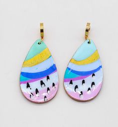 These handpainted earrings are the perfect statement piece - an artful combination of brush strokes that make a statement. Put 'em on, and you'll be the talk of the town! Seriously though, these earrings will bring out your inner artist with a look that's uniquely yours. These multi-color beauties shimmer and shine with a resin finish and iridescent details. Plus, the gold accents and gold finished hardware add a luxe touch. Colors will vary on different screens. Most appear brighter in person. Playful Hand Painted Dangle Jewelry, Hand Painted Enamel Artsy Earrings, Playful Hand Painted Dangle Earrings, Artisan Hand-painted Dangle Jewelry, Playful Hand-painted Dangle Earrings, Hand Painted Earrings, Talk Of The Town, Shimmer And Shine, Painted Earrings