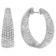 Sparkle all way with these beautiful inside out diamond hoop earrings. Crafted in fine 18K white gold. These earrings feature prong set round brilliant cut diamonds. The stones line only half of the outer hoop and half of the inner hoop. Total diamond weight: 3.31 carats. Diamond color G-H and clarity VS-SI. Earring length: 1 inch. Width: 8.3mm. Total weight: 15.44 grams. Secured with hinged back. Comes with a presentable gift box. White Gold Set, Beautiful Inside And Out, Diamond Hoop Earrings, Timeless Accessories, Jewelry Earrings Hoops, Round Brilliant Cut Diamond, Round Cut Diamond, Round Brilliant, Prong Setting