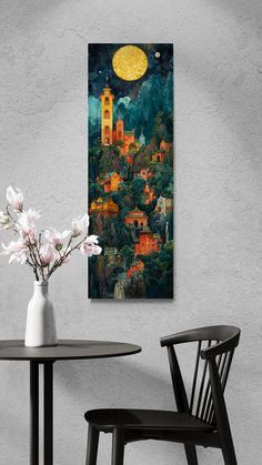 a painting on the wall above a table with two chairs and a vase filled with flowers