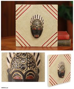 three pictures of african masks mounted to the side of a wooden wall, with red and white stripes around them