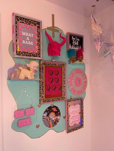 a wall with pictures and magnets on it in a child's room or playroom