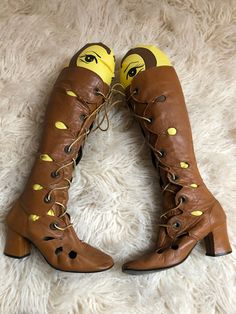 Late 60s gogo boots size 7 Rare chocolate brown lace up gogo boots with cut-outs. I'm a big collector and I haven't seen this style before Made in mexico  No size marked, but I would guess around a 7 a measurements below. I'm too big for them which is why they look odd on my foot. Lace up the front with grommets. Shoelaces are leather  Scalloped where the grommets are for more fun detail Teardrop cut outs up the legs and on the foot Rounded toe Chunky heel  Leather outer, lined in nylon  Very go Retro Lace-up Boots For Spring, Retro Lace-up Spring Boots, Retro Brown Boots For Spring, Brown Retro Boots For Spring, Vintage High-top Boots For Spring, Vintage Party Boots For Spring, Vintage Party Boots, Vintage Spring Party Boots, Vintage Lace-up Party Boots