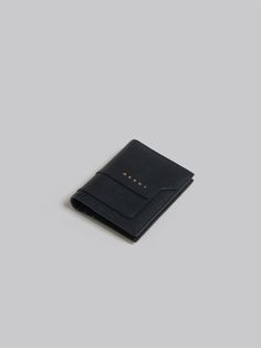 Saffiano leather cardholder with snap button closure. Equipped with a keyring and six card slots. Front Marni logo. Palladium hardware. Leather Cardholder, Trunk Bag, Boot Pumps, Card Holder Wallet, Pumps Flat, Cool Socks, Card Holder Leather, Small Leather Goods, Card Wallet