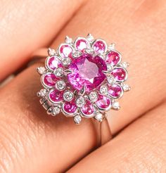 * Condition: Brand new * Center Stone: Natural Pink Sapphire, Oval Cut, approx 1.51ct * Side stones: Natural White Diamond round-cut (VS1 clarity with F color) * Metal Purity: 18K Solid White Gold (Optional) * Ring Weight: 5.33g (actual weight depend on the ring size) * Free DHL Express Shipping. * Attached with Certificate. * Each piece is made-to-order with care and special attention to detail. all items are made with conflict-free diamonds and gems. * The item will be gift wrapped and shipped Ballerina Flower, Cluster Jewelry, Luxury Jewelry Box, Ring Cluster, Buying An Engagement Ring, Bridal Diamond Jewellery, Purple Sapphire, White Gold Engagement Ring, 18k Gold Ring