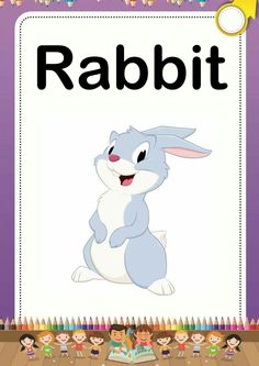 an animal that is sitting in front of a sign with the word rabbit on it