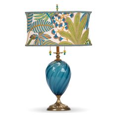 a blue lamp with a green and white shade on it