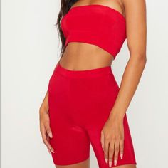 Two Piece Red Bandeau And Biker Shorts Summer Party Biker Shorts, Fitted Biker Shorts For Summer Parties, Red Tube Top For Summer Night Out, Red Tube Top For Spring Night Out, Red Biker Shorts For Summer, Chic Red Stretch Shorts, Chic Stretch Red Shorts, Red Stretch Tube Top For Summer, Trendy Red Shorts For Night Out