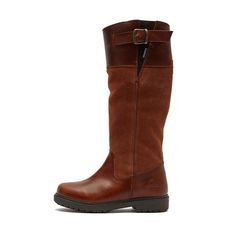 a woman's brown boots on a white background