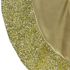 two different colors of fabric with gold and silver glitters on the top one side